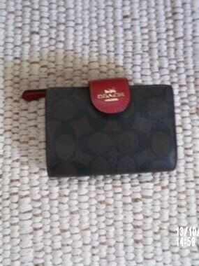 Red and brown Coach wallet